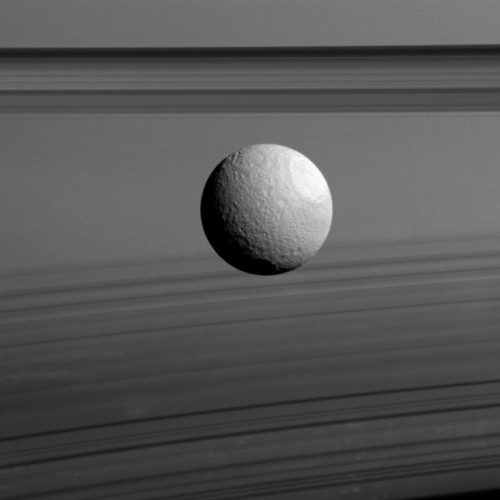 Saturn's moon Tethys with the planet's rings in the background (Image NASA/JPL-Caltech/Space Science Institute)