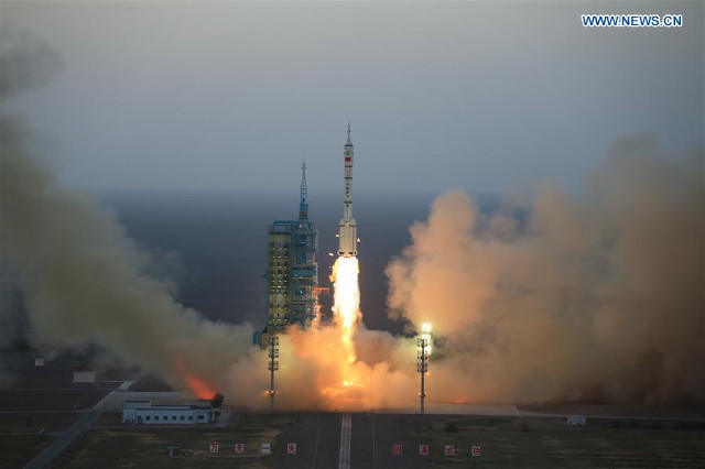 The Shenzhou 11 spacecraft blasting off atop a Long March 2F rocket (Image courtesy Xinhua)