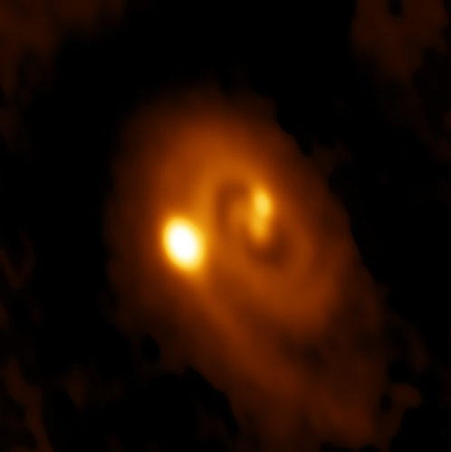 The L1448 IRS3B system (Image Bill Saxton, ALMA (ESO/NAOJ/NRAO), NRAO/AUI/NSF)