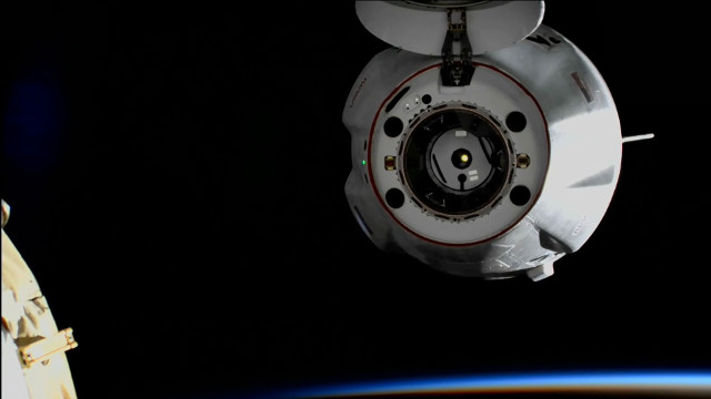 The Dragon cargo spacecraft departing the International Space Station to end its CRS-25 mission
