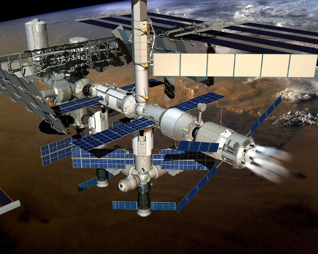 Artistic concept of the ATV-5 cargo spaceship breaking the International Space Station