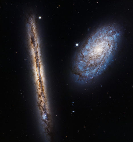 The galaxies NGC 4302 and NGC 4298 (Photo NASA, ESA, and M. Mutchler (STScI))