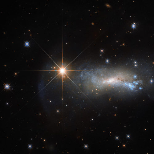 The galaxy NGC 7250 and the star TYC 3203-450-1 (Image ESA/Hubble & NASA)