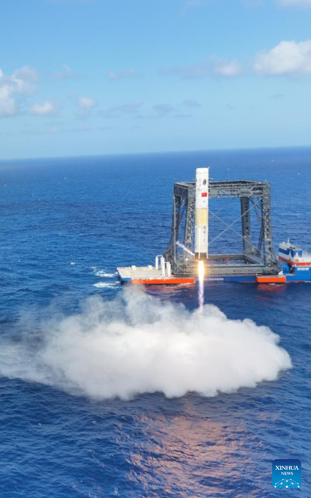 The first stage of the Long March 10 rocket splashes down (Photo courtesy Han Qingce/Xinhua)