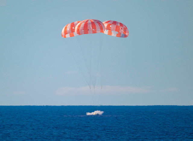 The Orion Integrity spacecraft splashing down (Photo NASA/Bill Ingalls)