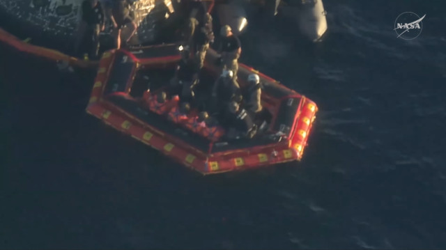 The Artemis II mission crew on an inflatable raft (Image NASA)